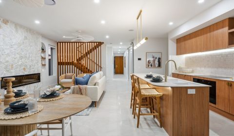 Open-plan kitchen and living area in an Emerald Developments display home