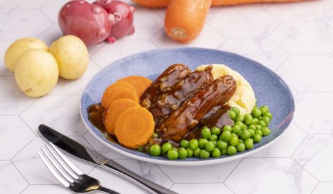 Top Nosh Meals bangers and mash with carrots, peas and mashed potato